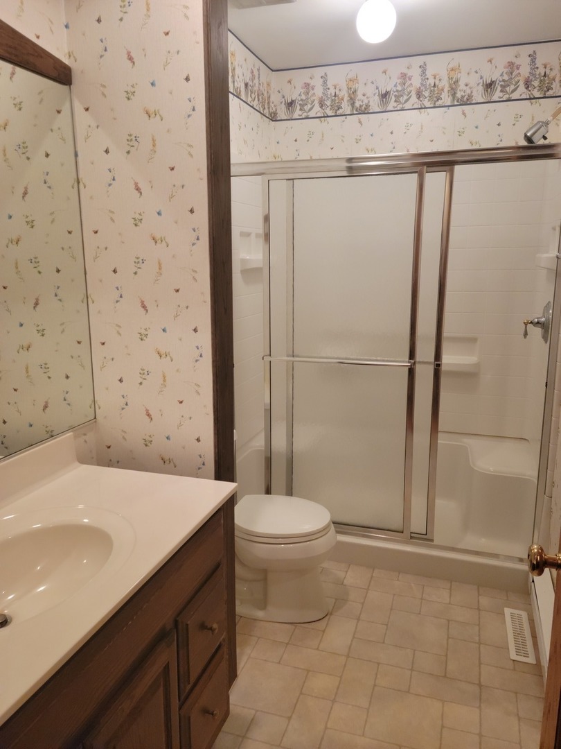 18715 Hebron Road Harvard, IL 60033 - Photo 43 of 54 a bathroom with a sink a toilet and shower