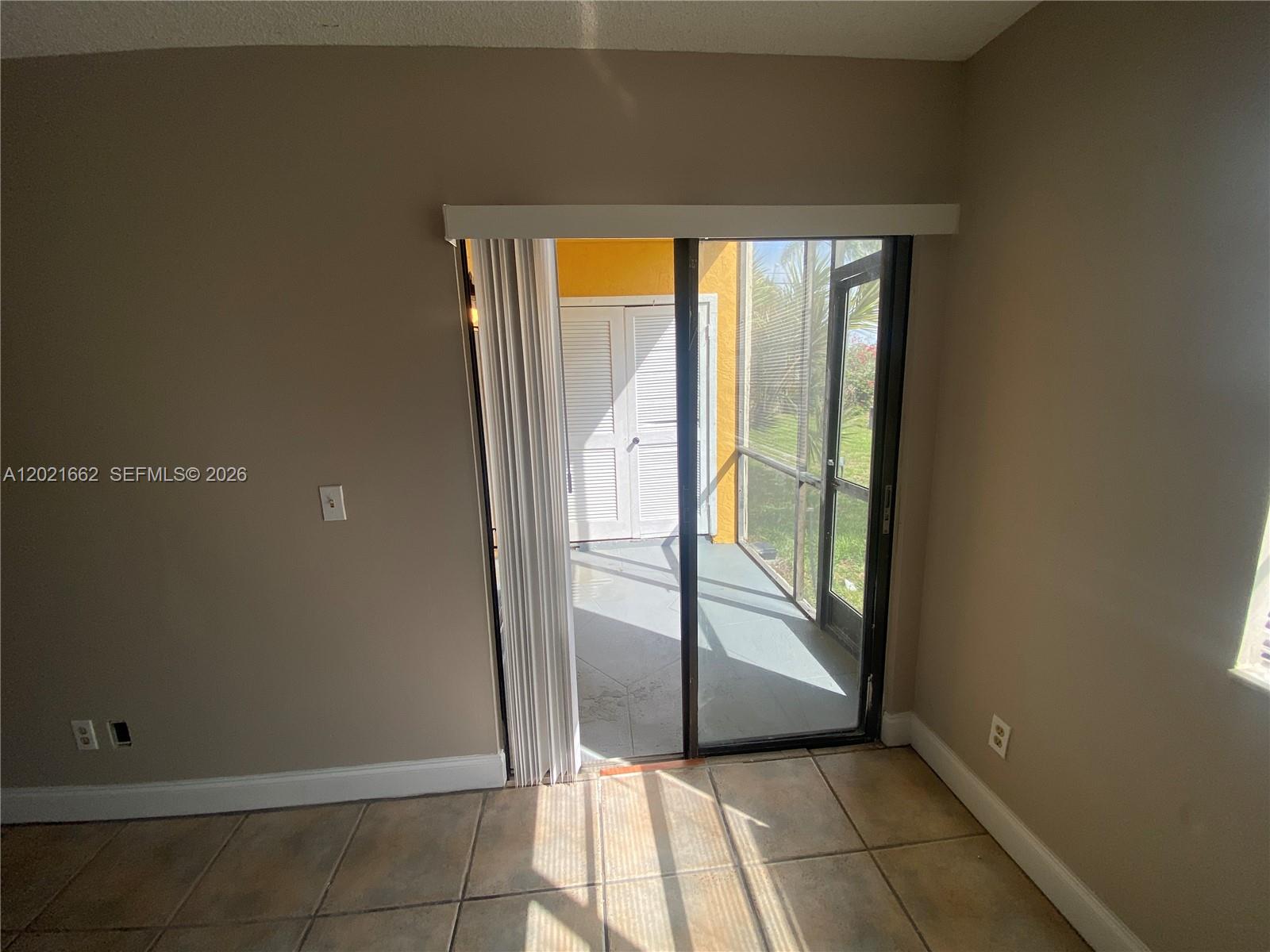 3263 Kirk Road, Unit 2 Lake Worth, FL 33461 - Photo 4 of 14 a view of an empty room and window