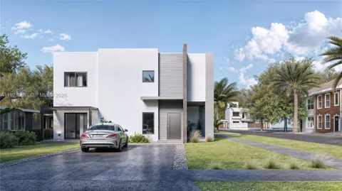 a car parked in front of a brick house
