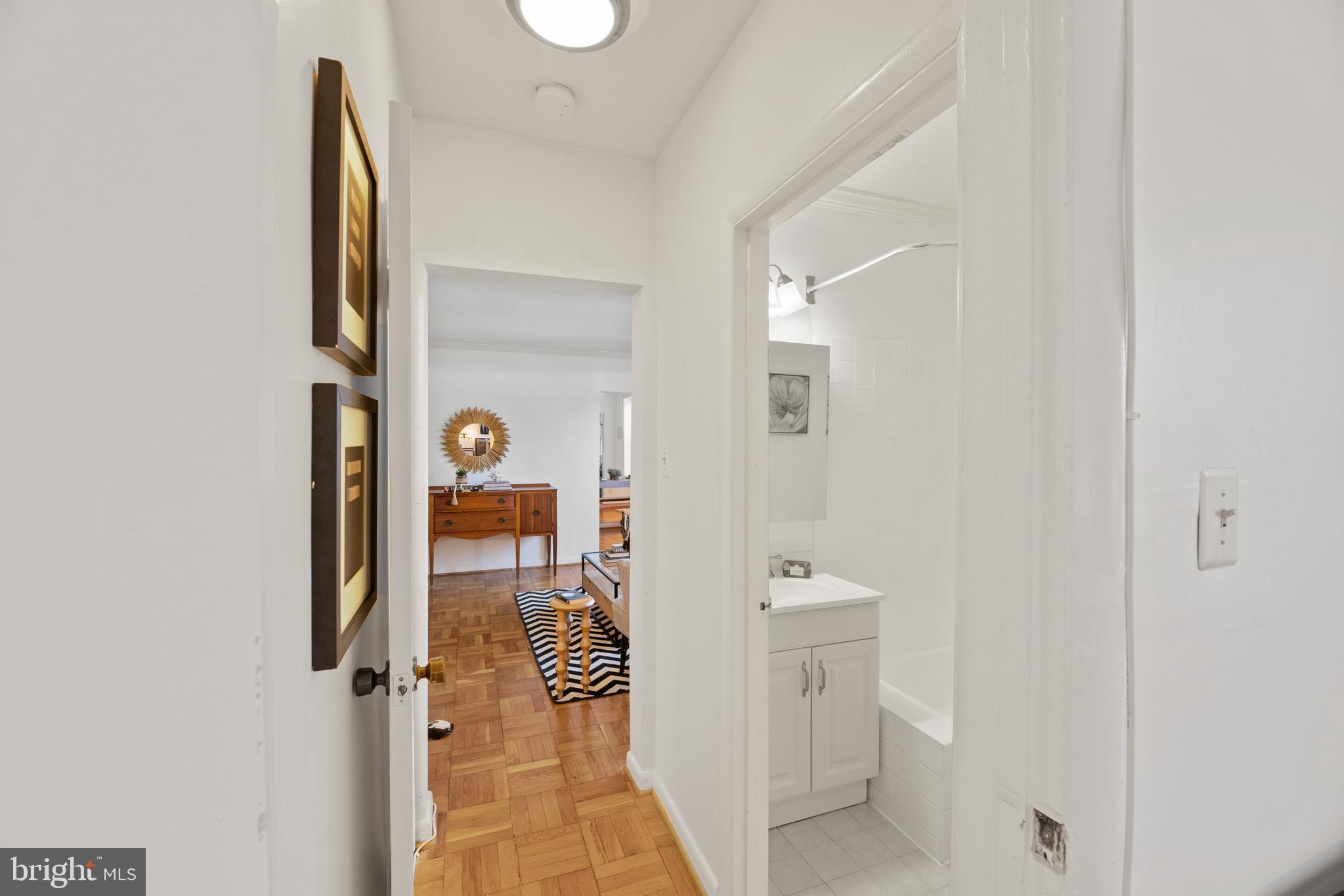 3051 Idaho Avenue Northwest, Unit 119 Washington, DC 20016 - Photo 15 of 36 a bathroom with a sink and a mirror