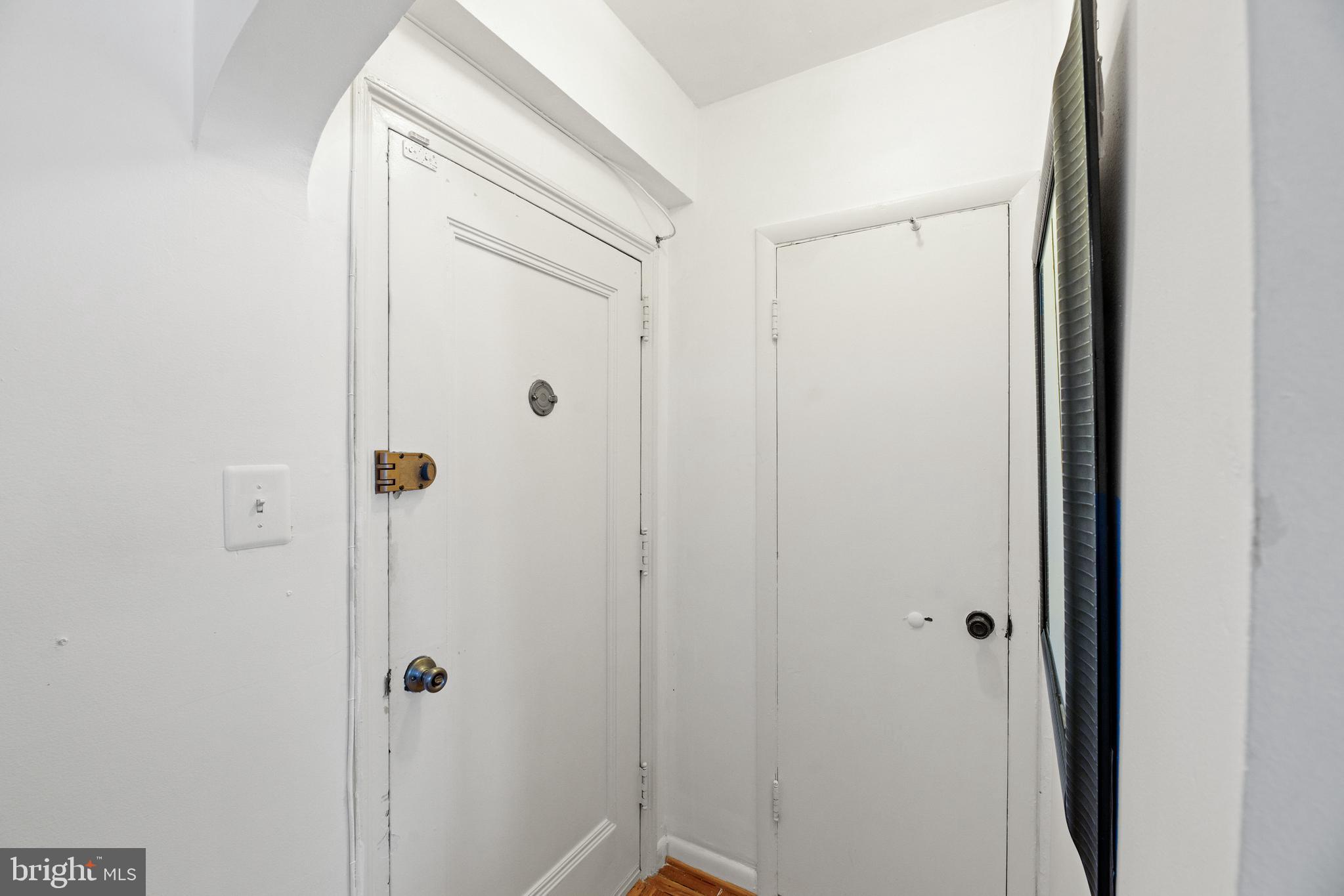 3051 Idaho Avenue Northwest, Unit 119 Washington, DC 20016 - Photo 2 of 36 a bathroom with a glass shower door