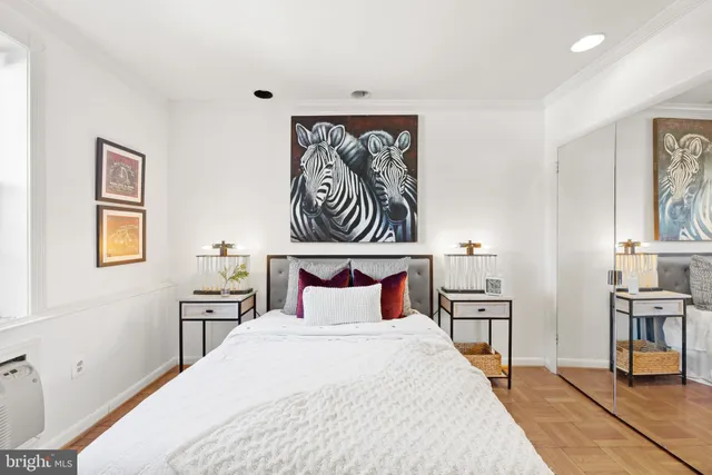 a bedroom with a bed and a table