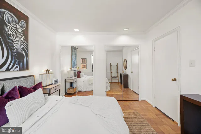 a bedroom with a bed and a view of bathroom