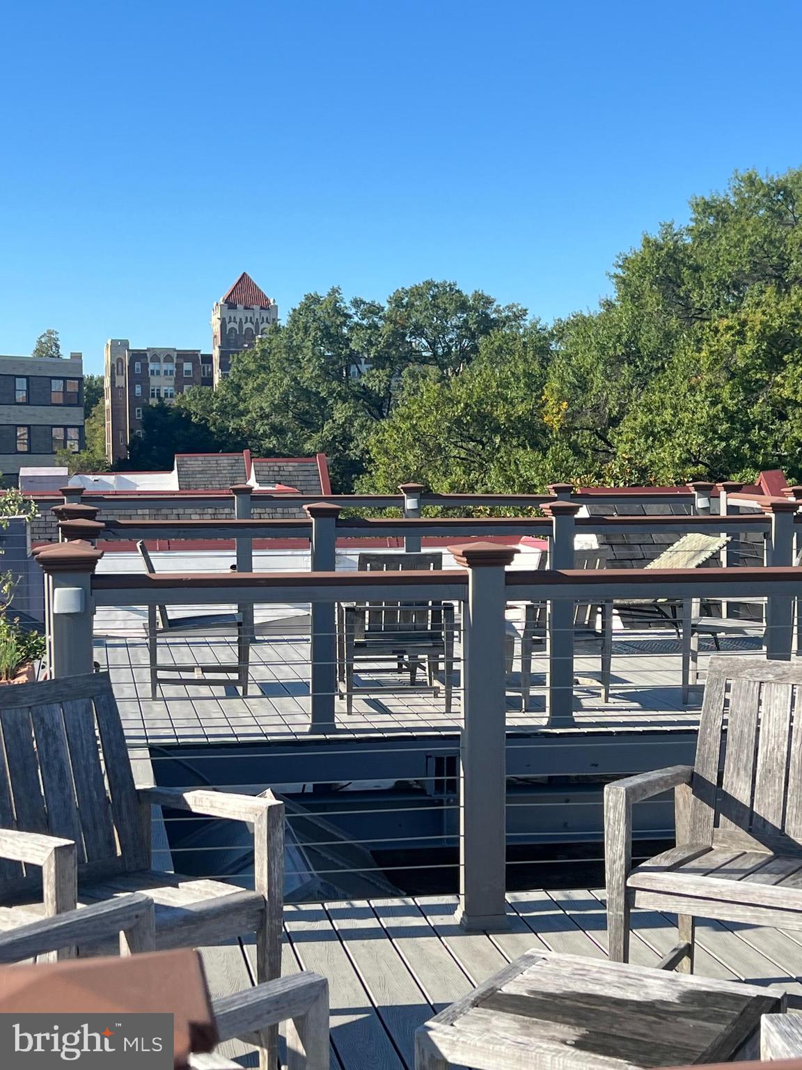 3051 Idaho Avenue Northwest, Unit 119 Washington, DC 20016 - Photo 33 of 36 a view of a chairs and table in the terrace