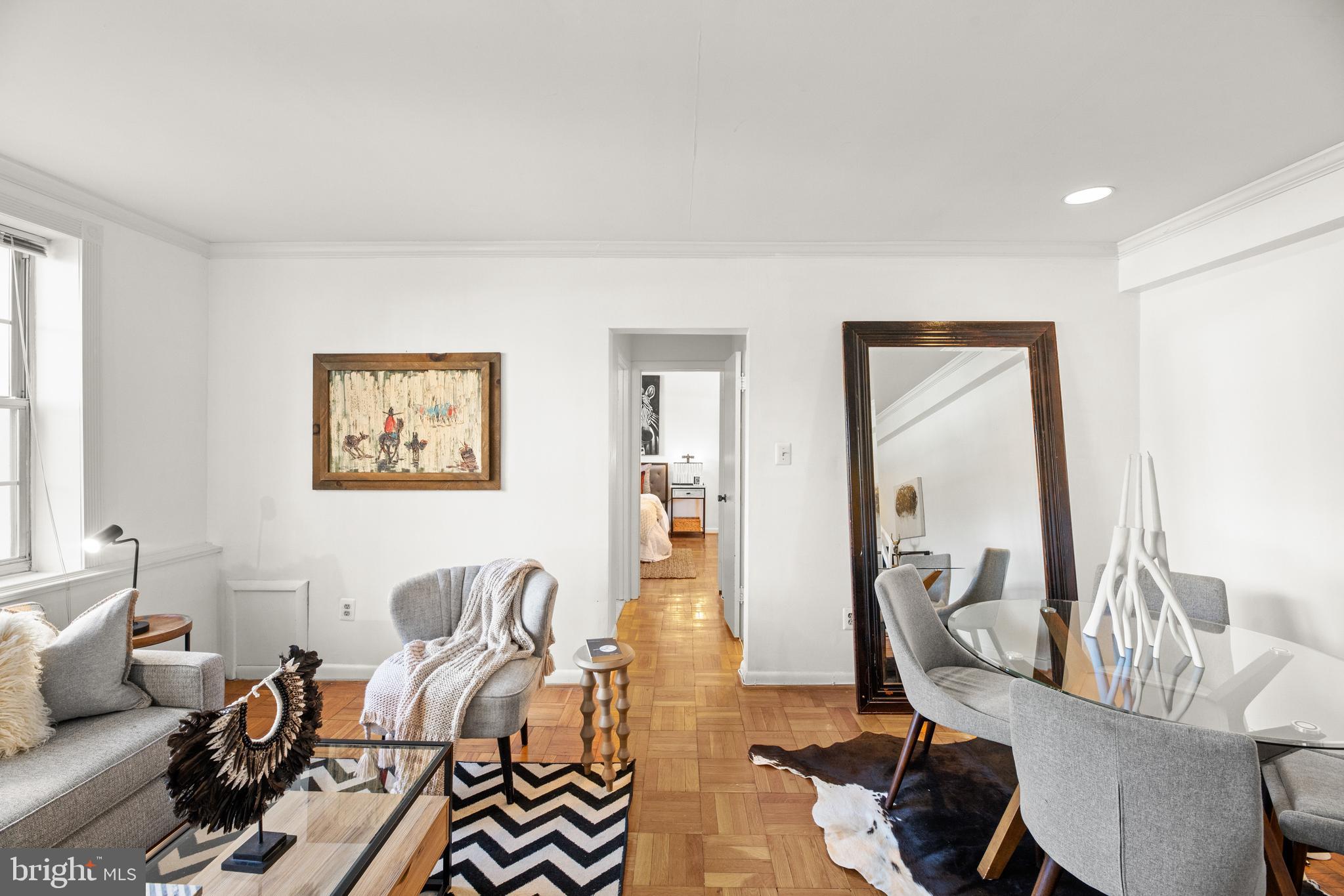 3051 Idaho Avenue Northwest, Unit 119 Washington, DC 20016 - Photo 4 of 36 a living room with furniture