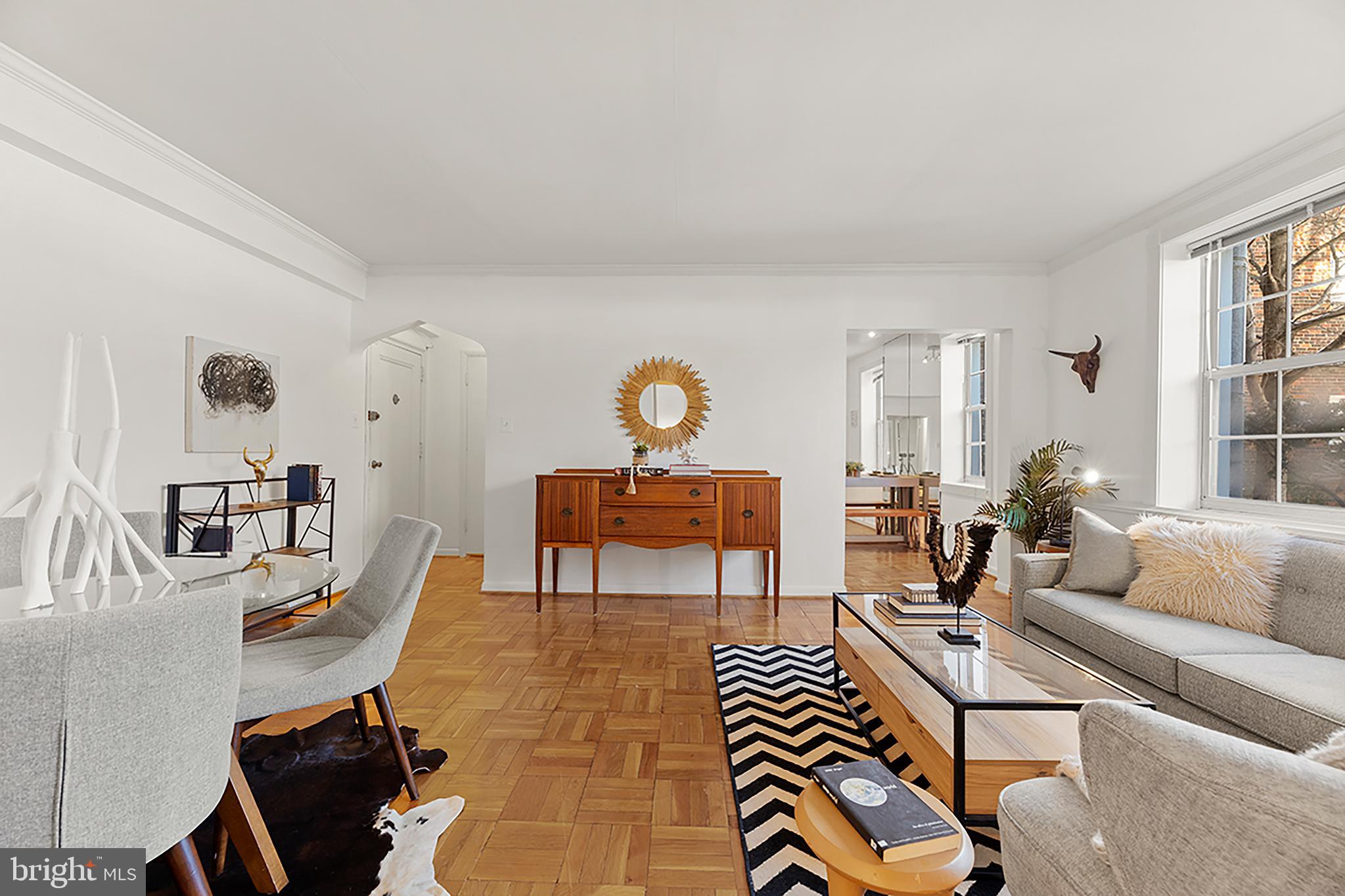 3051 Idaho Avenue Northwest, Unit 119 Washington, DC 20016 - Photo 7 of 36 a living room with furniture