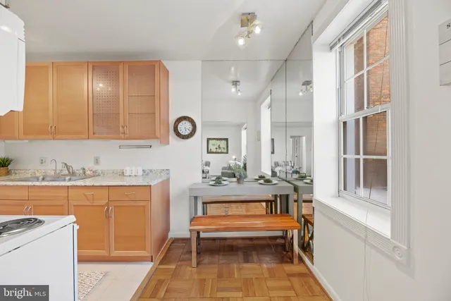 a view of a kitchen with cabinets and outdoor seating