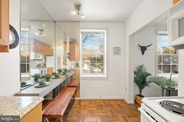 a very nice looking room with kitchen area