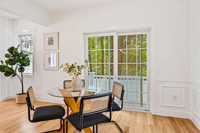 a dining room with furniture and wooden floor