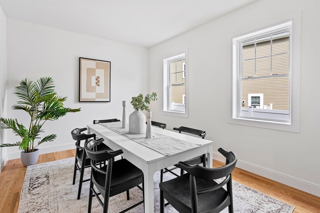 75 Franklin Street, Unit 2 Arlington, MA 02474 - Photo 16 of 38 a view of a dining room with furniture and wooden floor