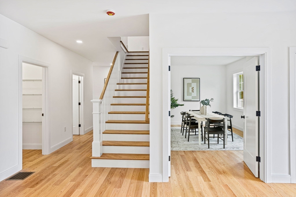 75 Franklin Street, Unit 2 Arlington, MA 02474 - Photo 17 of 38 a view of a room with wooden floor and chairs