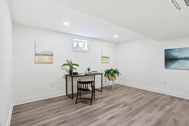 a workspace with furniture and wooden floor