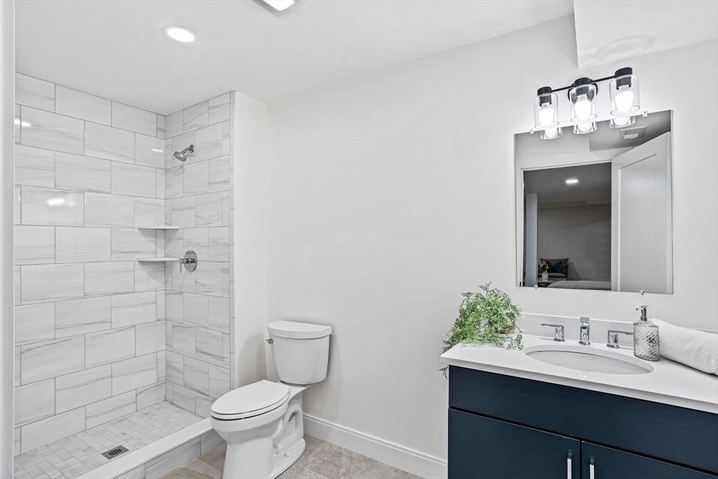 75 Franklin Street, Unit 2 Arlington, MA 02474 - Photo 33 of 38 a bathroom with a sink toilet and shower