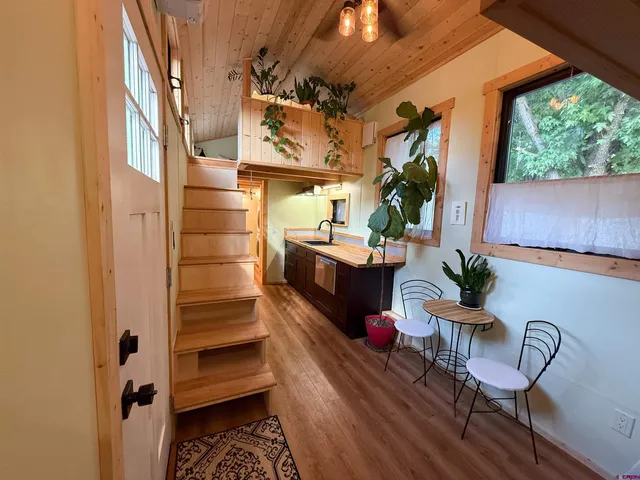 a balcony with furniture and a potted plant