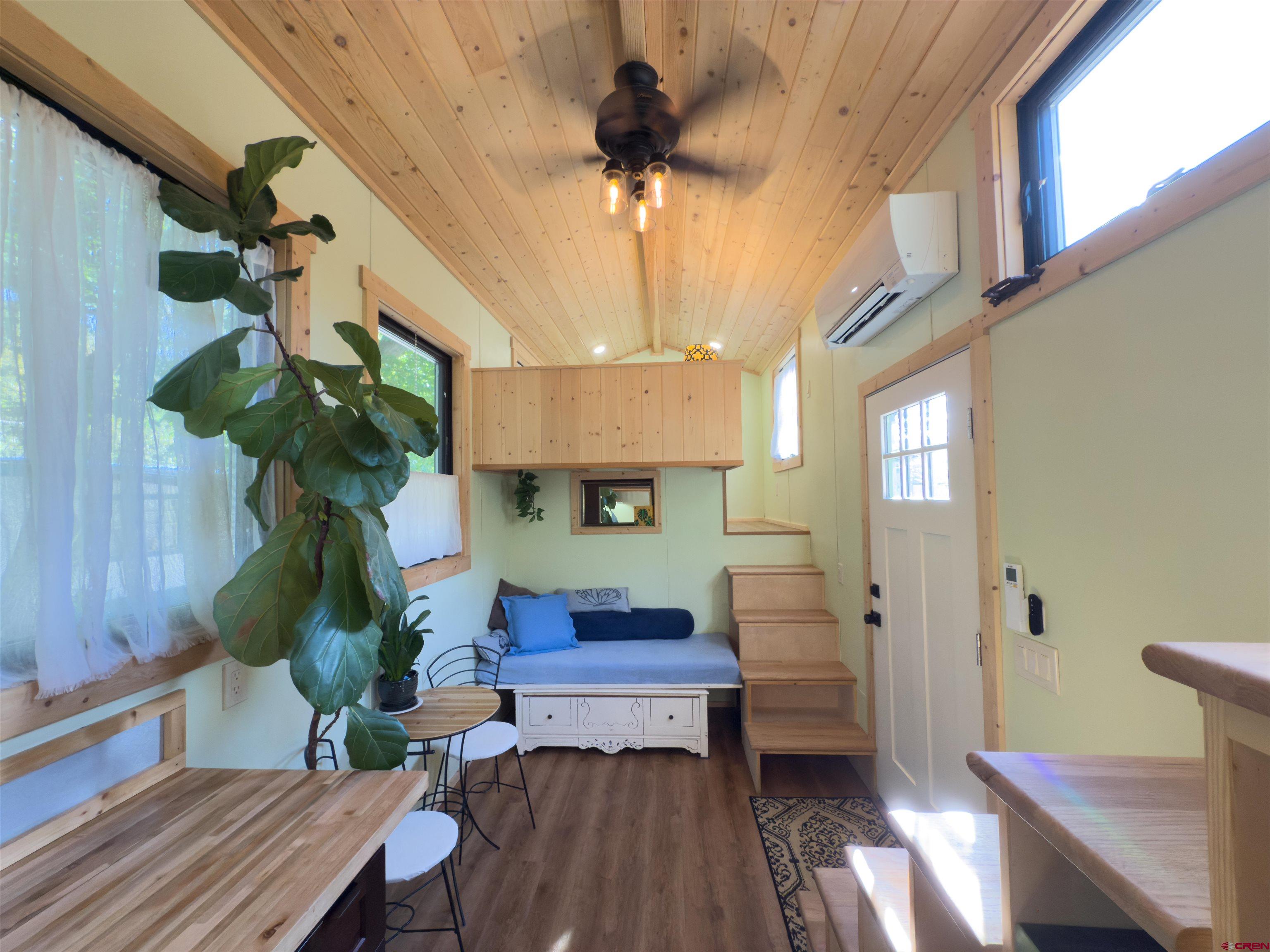 485 Florida Road, Unit C5 Durango, CO 81301 - Photo 4 of 40 a living room with furniture a chandelier and a window