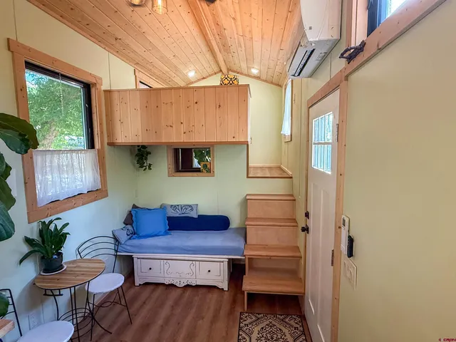 a kitchen with a refrigerator and a table