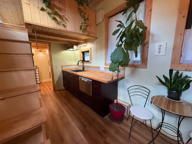 a bedroom with a bed and a mirror