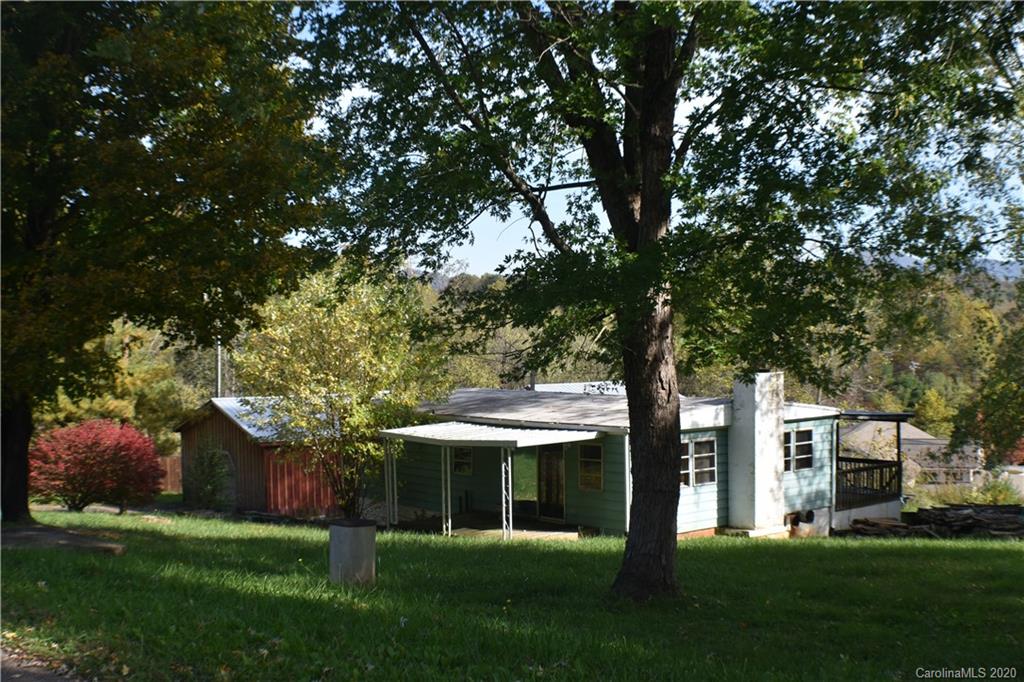 49 Trantham Road Canton, NC 28716 - Photo 1 of 10 a front view of a house with a garden