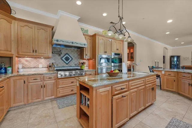 a bedroom with a bed and painting on the wall