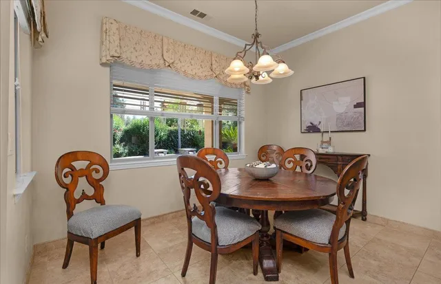 a view of a patio with a backyard table and chairs