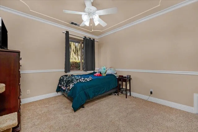 a view of a house with furniture and floor to ceiling windows