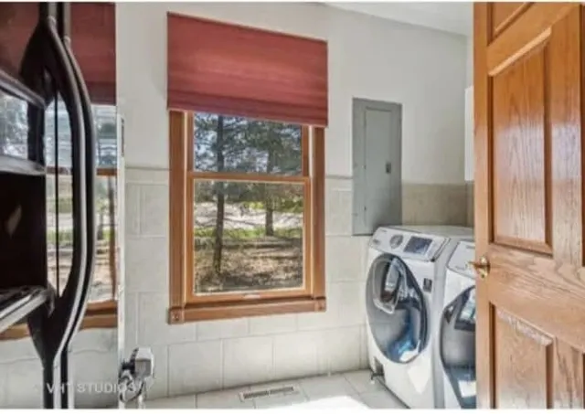 a utility room with dryer and washer