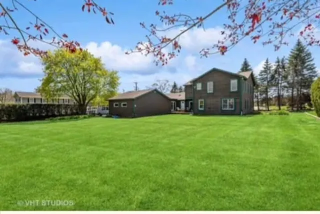 a view of a house with a garden
