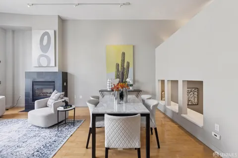 a dining room with furniture and window