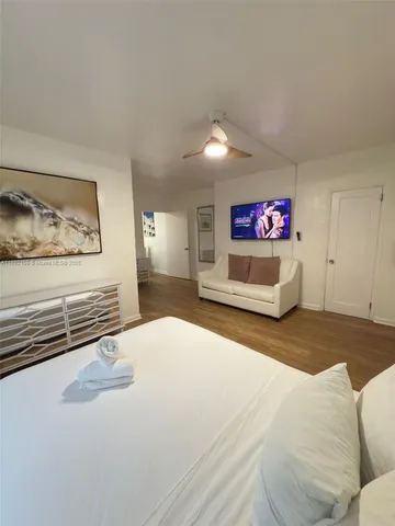 a bedroom with a bed and a couch