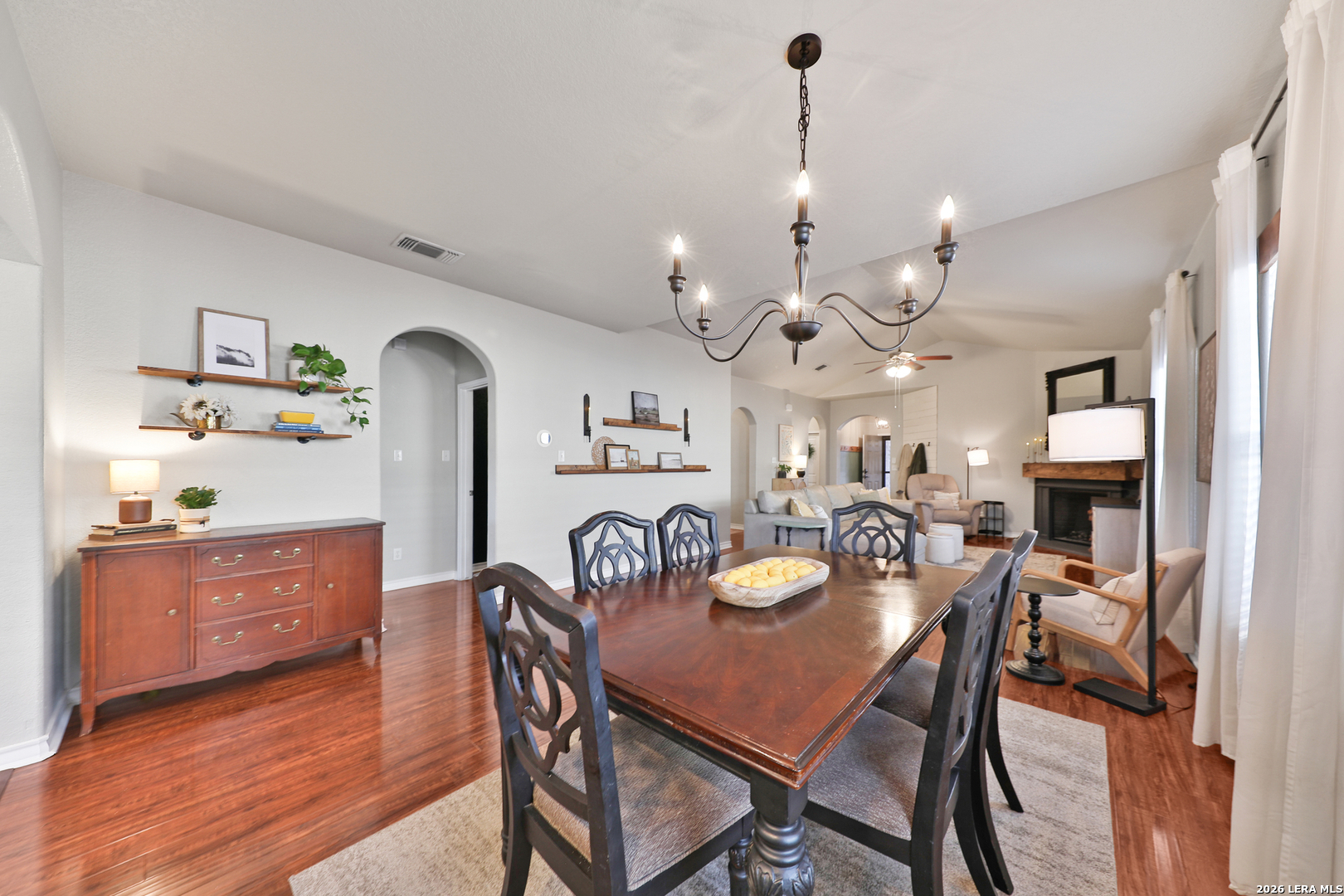 10414 Pecne Path Helotes, TX 78023 - Photo 12 of 42 a view of a dining room with furniture and wooden floor