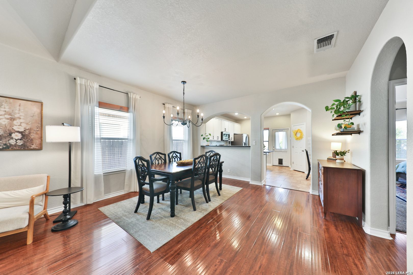 10414 Pecne Path Helotes, TX 78023 - Photo 13 of 42 a view of a dining room with furniture window and wooden floor