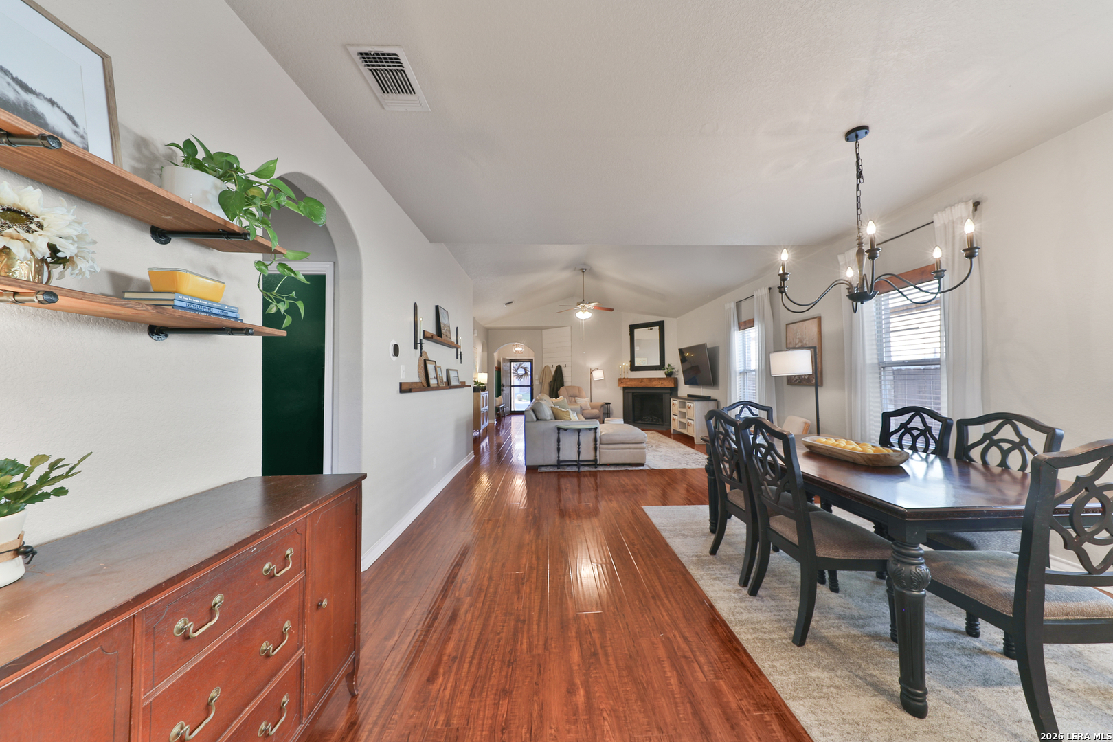 10414 Pecne Path Helotes, TX 78023 - Photo 14 of 42 a dining room with furniture entryway and wooden floor