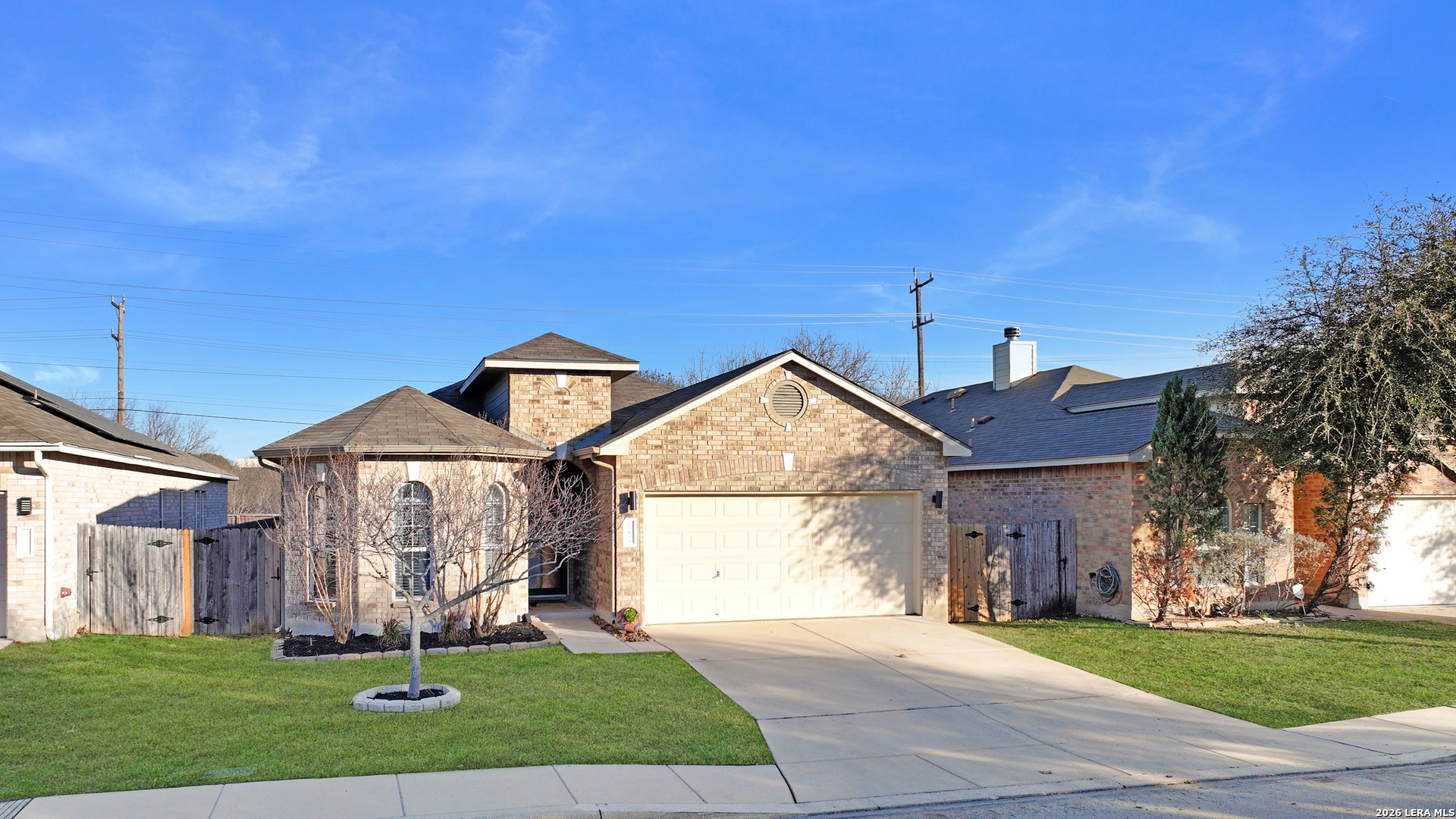 10414 Pecne Path Helotes, TX 78023 - Photo 2 of 42 a front view of a house with a yard and garage