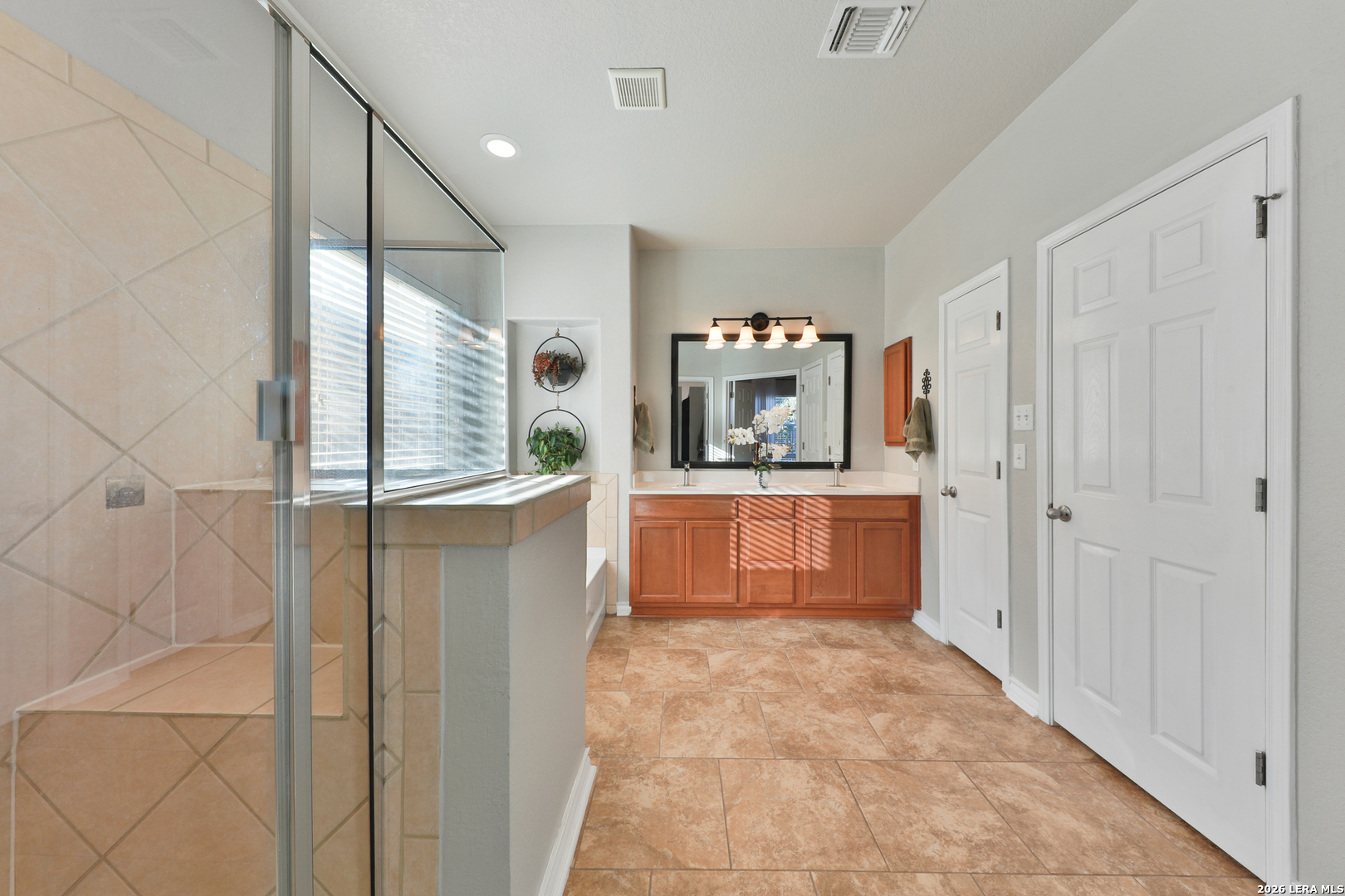 10414 Pecne Path Helotes, TX 78023 - Photo 29 of 42 a kitchen with stainless steel appliances a refrigerator and a stove