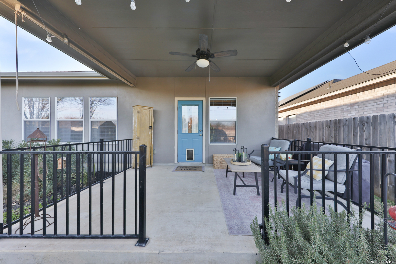 10414 Pecne Path Helotes, TX 78023 - Photo 38 of 42 a dining room with furniture and a floor to ceiling window