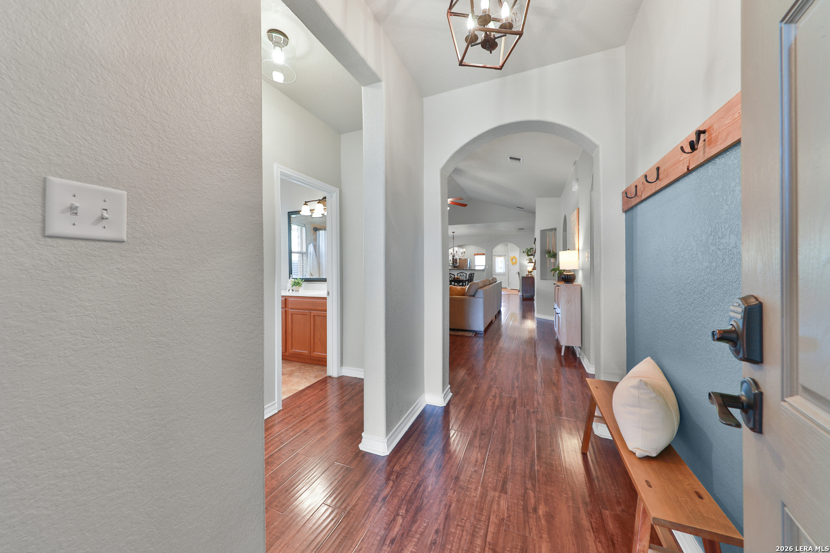 10414 Pecne Path Helotes, TX 78023 - Photo 4 of 42 a view of a hallway view with wooden floor and staircase