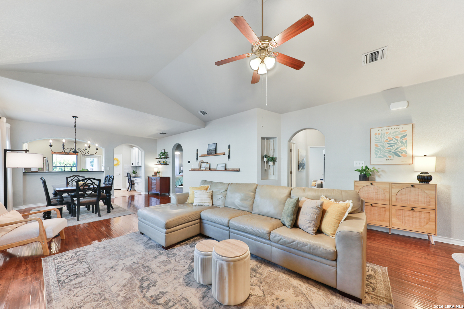10414 Pecne Path Helotes, TX 78023 - Photo 8 of 42 a living room with furniture and a chandelier