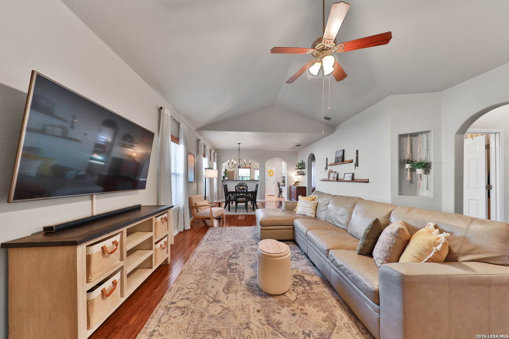 10414 Pecne Path Helotes, TX 78023 - Photo 9 of 42 a living room with furniture and a flat screen tv