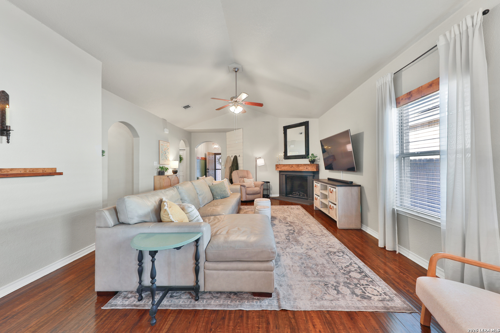 10414 Pecne Path Helotes, TX 78023 - Photo 10 of 42 a living room with furniture and a flat screen tv