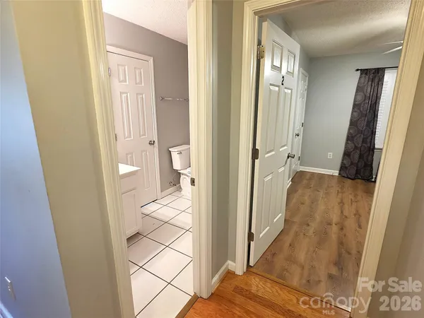 a view of a bathroom from a hallway