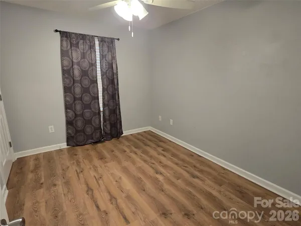 wooden floor and window in an empty room