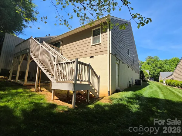 a view of backyard with deck and backyard