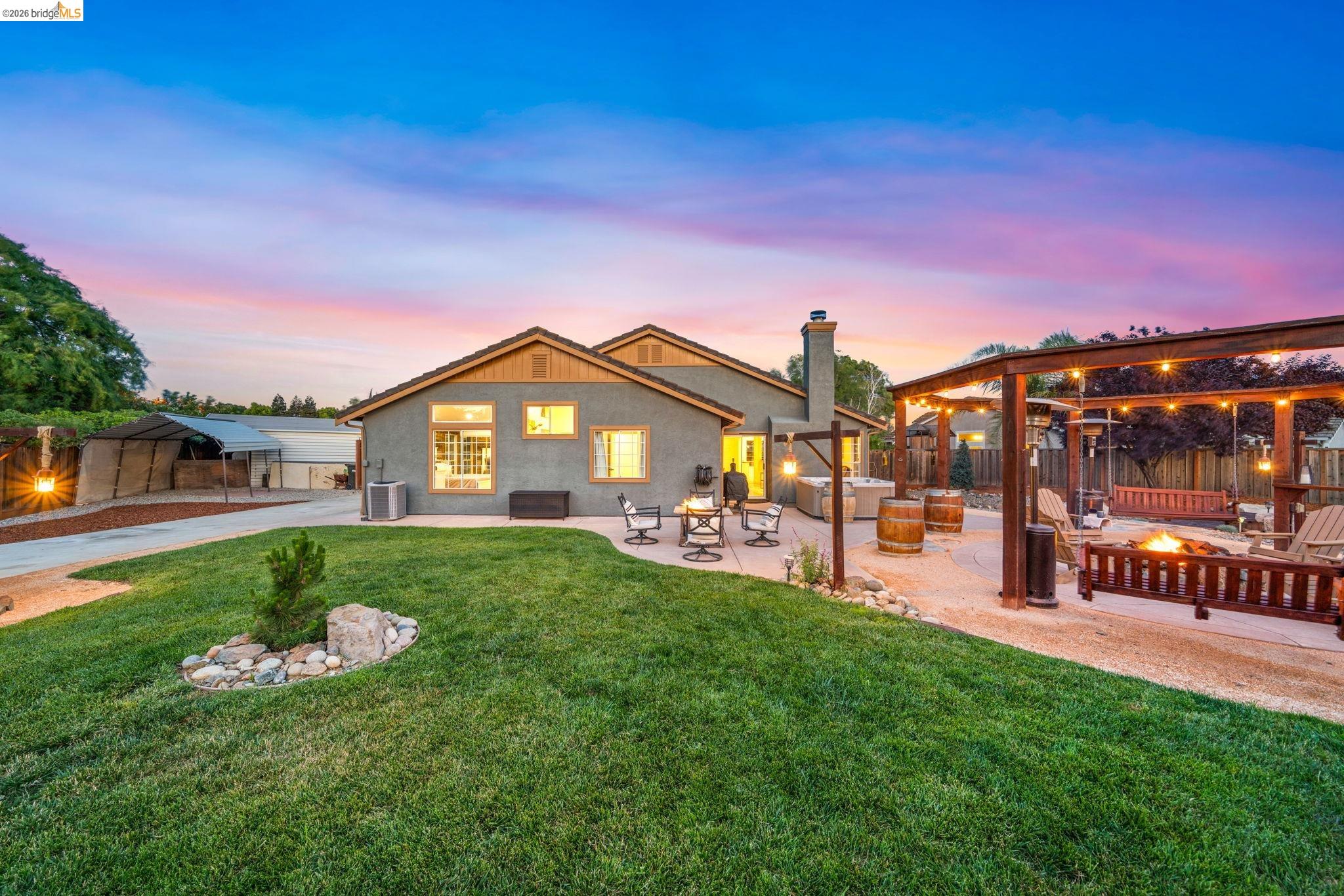 1186 El Rio Court Livermore, CA 94551 - Photo 42 of 60 Spacious backyard featuring a manicured lawn, an expansive patio, and multiple pergolas