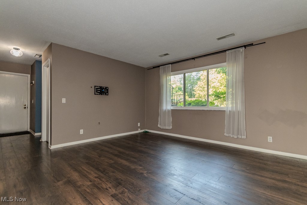 2969 Gale Road Willoughby, OH 44094 - Photo 32 of 46 Spare room featuring baseboards and dark wood-type flooring