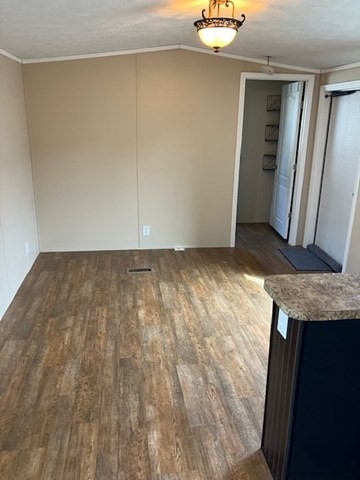 557 Southwest Cutoff, Unit 100 Worcester, MA 01607 - Photo 11 of 31 a view of an empty room with wooden floor and closet area