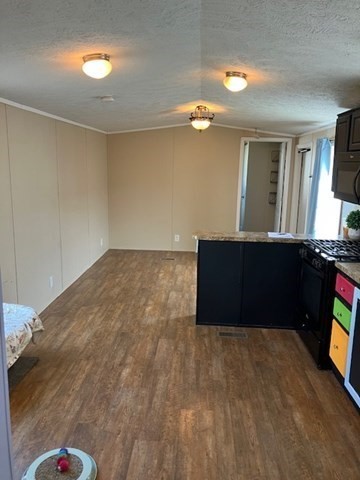 557 Southwest Cutoff, Unit 100 Worcester, MA 01607 - Photo 12 of 31 a bedroom with a bed and a dresser