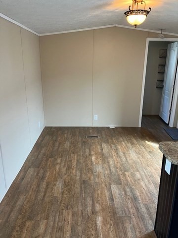 557 Southwest Cutoff, Unit 100 Worcester, MA 01607 - Photo 13 of 31 a view of a room with wooden floor