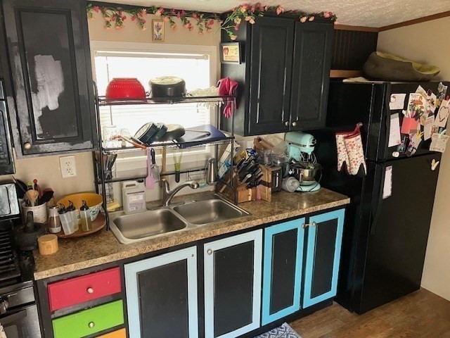 557 Southwest Cutoff, Unit 100 Worcester, MA 01607 - Photo 19 of 31 a kitchen with a sink and a stove