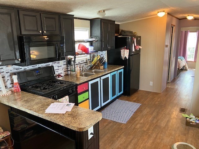 557 Southwest Cutoff, Unit 100 Worcester, MA 01607 - Photo 20 of 31 a kitchen with stainless steel appliances granite countertop a stove refrigerator and microwave