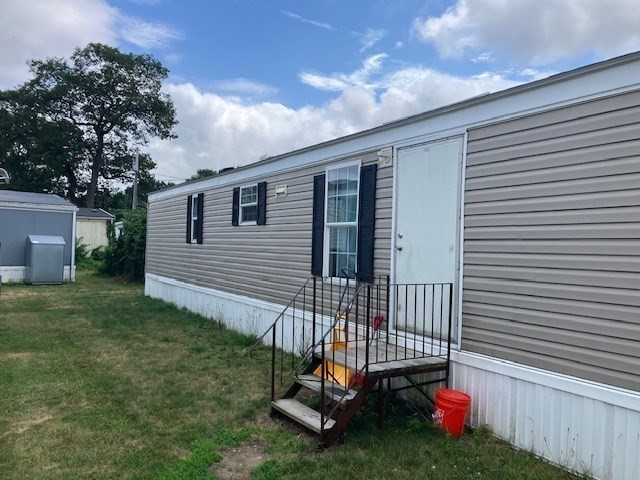 557 Southwest Cutoff, Unit 100 Worcester, MA 01607 - Photo 21 of 31 a view of backyard with a garden